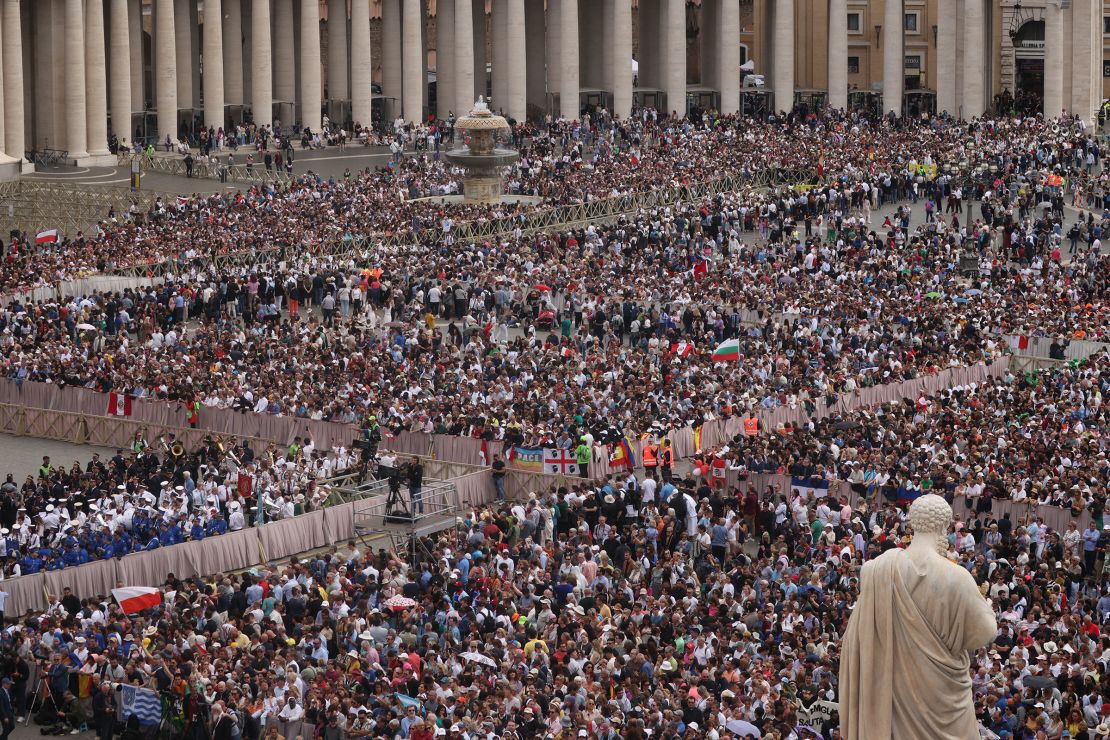 People gather in St. Peter's Square on Sunday.