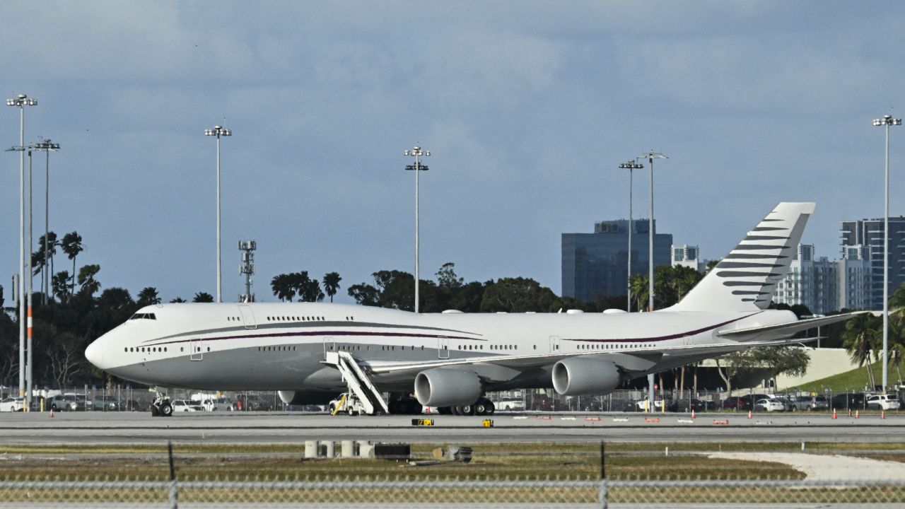 In this February 15, 2025 a Qatari Boeing 747 sits on the tarmac of Palm Beach International airport after US President Donald Trump toured the aircraft on February 15, 2025. Donald Trump plans to accept a luxury Boeing jet from the Qatari royal family for use as Air Force One and then continue flying in it after his tenure, despite strict rules on US presidential gifts, media reported May 11, 2025. Calling the plane a "flying palace," ABC News, which first reported the story, said the Boeing 747-8 jumbo jet would possibly be the most expensive gift ever received by the American government. (Photo by ROBERTO SCHMIDT / AFP) (Photo by ROBERTO SCHMIDT/AFP via Getty Images)          