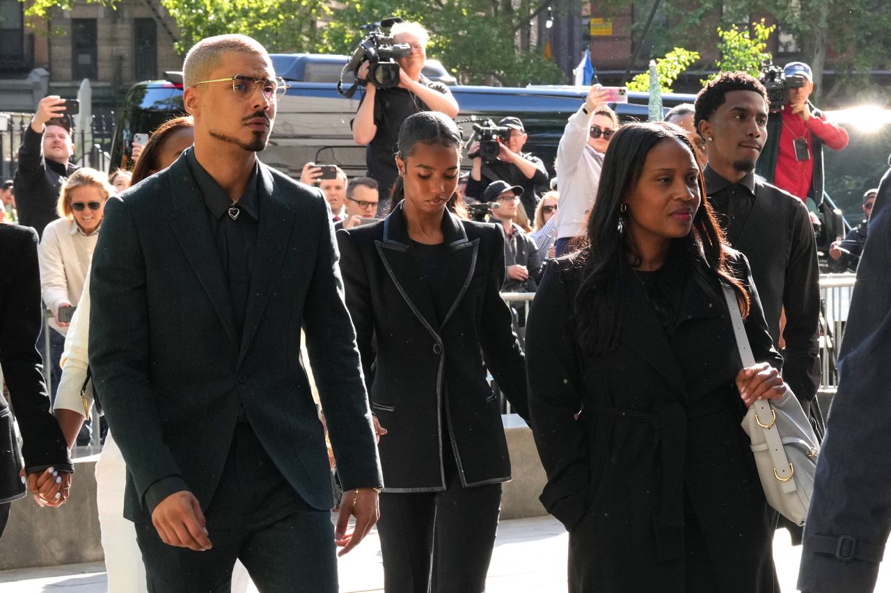 Quincy Brown, left, stepson of Sean Combs, walks with other members of the Combs family as they arrive at federal court for the sex trafficking trial of Sean