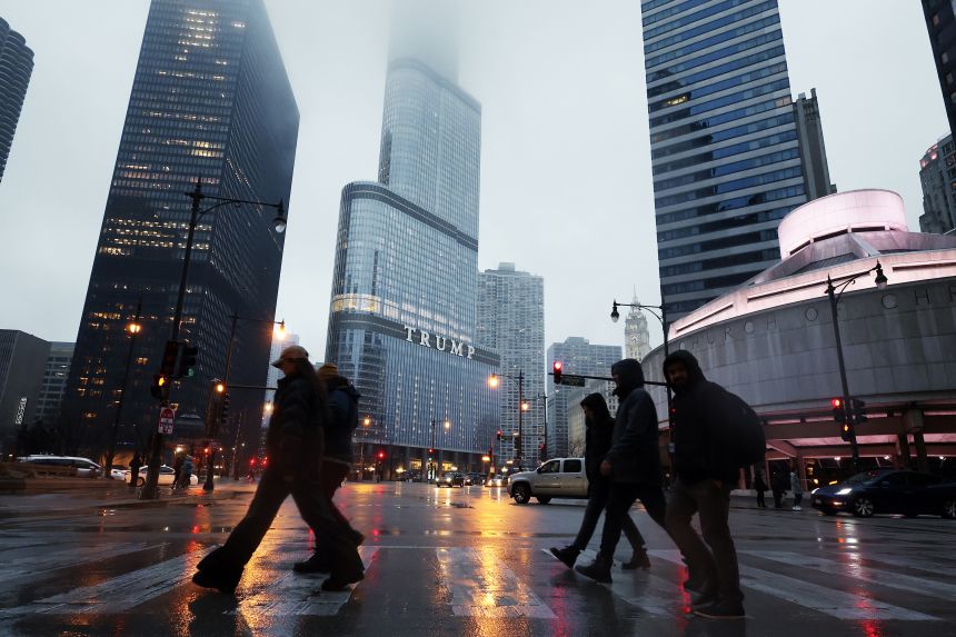 People walk past Trump International Hotel & Tower in Chicago on March 7.