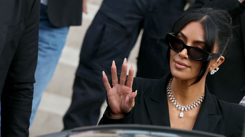 TOPSHOT - US celebrity Kim Kardashian leaves the courthouse after testifying before the Assize Court for the trial over the 2016 robbery that saw her relieved of millions of dollars' worth of jewellery at gunpoint in Paris, on May 13, 2025. The trial of this sensational nine million euro jewellery robbery opened in Paris on April 28, 2025. (Photo by Alain JOCARD / AFP) (Photo by ALAIN JOCARD/AFP via Getty Images)          