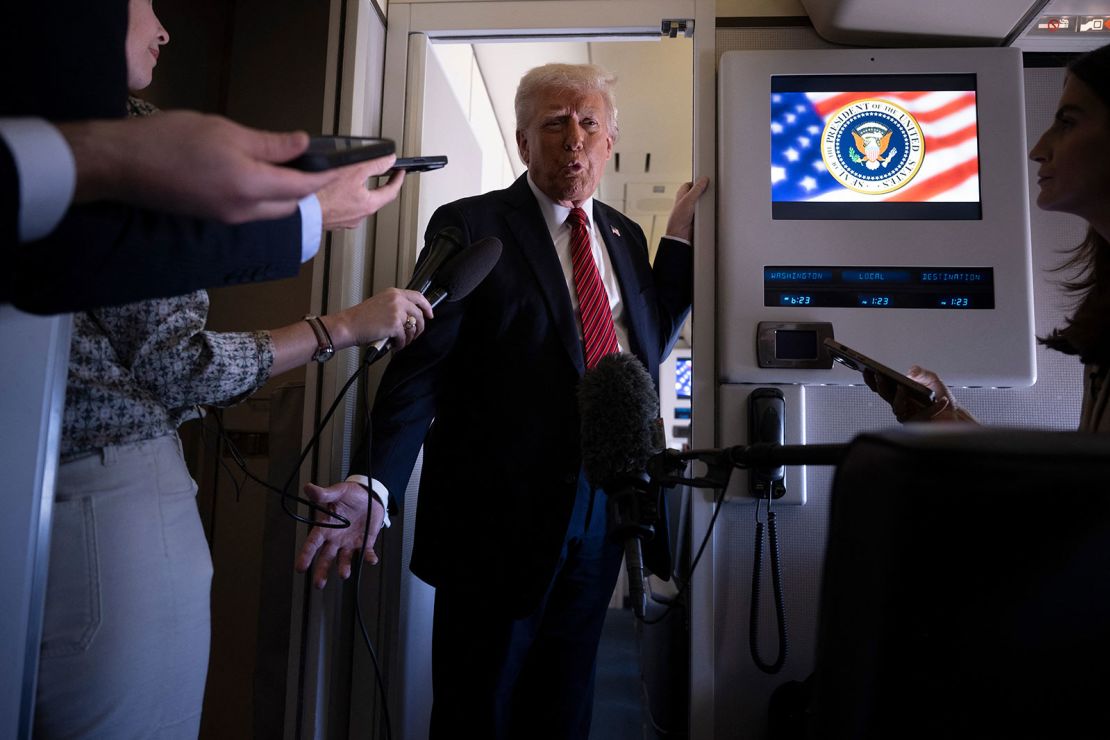 President Donald Trump listens to questions as he speaks to members of the press on Air Force One on his way to Qatar on May 14, 2025.
