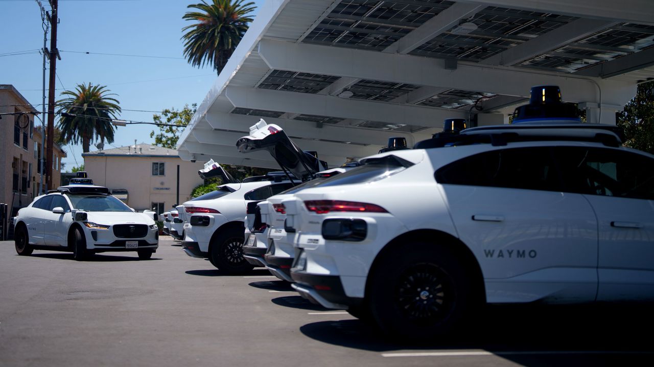 SANTA MONICA, CALIFORNIA - MAY 14:  Waymo vehicles charge at a charging station on May 14, 2025 in Santa Monica, California. Waymo, owned by Alphabet, is recalling more than 1,200 self-driving vehicles to update software to address risks of collisions with roadway barriers after U.S. safety investigators opened a probe.  (Photo by Eric Thayer/Getty Images)