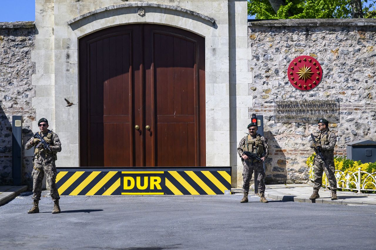 Turkish security personnel stand alert at the entrance to Dolmabahce Palace in Istanbul, where direct talks between Russian and Ukrainian delegations are expected to take place on Thursday.