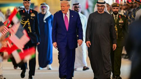 TOPSHOT - UAE President Sheikh Mohamed bin Zayed Al Nahyan (R) welcomes his US counterpart Donald Trump upon arrival at the presidential terminal in Abu Dhabi on May 15, 2025. The United Arab Emirates is the third leg of Trump's visit to the region, which has already taken him to Saudi Arabia and Qatar. (Photo by Giuseppe CACACE / AFP) (Photo by GIUSEPPE CACACE/AFP via Getty Images)          