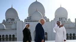 TOPSHOT - Yousif al-Obaidli, (R) the director-general of the Sheikh Zayed Grand Mosque, accompanies US President Donald Trump on a tour of the mosque in Abu Dhabi on May 15, 2025. The United Arab Emirates is the third leg of Trump's visit to the region, which has already taken him to Saudi Arabia and Qatar. (Photo by Brendan SMIALOWSKI / AFP) (Photo by BRENDAN SMIALOWSKI/AFP via Getty Images)          