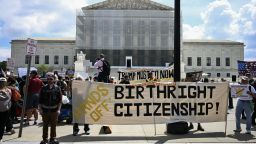 People hold banners and signs as they participate in a protest outside the US Supreme Court over President Donald Trump's move to end birthright citizenship as the court hears arguments over the order in Washington, DC, on May 15, 2025. Trump issued an executive order on his first day in office seeking to limit birthright citizenship for children whose parents are in the United States illegally or on temporary visas, but it has been blocked in multiple appellate courts. He appealed the case to the Supreme Court on March 13. (Photo by Jim WATSON / AFP) (Photo by JIM WATSON/AFP via Getty Images)          