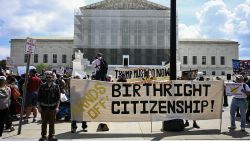 People hold banners and signs as they participate in a protest outside the US Supreme Court over President Donald Trump's move to end birthright citizenship as the court hears arguments over the order in Washington, DC, on May 15, 2025. Trump issued an executive order on his first day in office seeking to limit birthright citizenship for children whose parents are in the United States illegally or on temporary visas, but it has been blocked in multiple appellate courts. He appealed the case to the Supreme Court on March 13. (Photo by Jim WATSON / AFP) (Photo by JIM WATSON/AFP via Getty Images)          