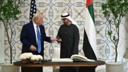 President Donald Trump returns the pen to his UAE counterpart Sheikh Mohamed bin Zayed Al Nahyan, after signing the guest book at Qasr Al-Watan  in Abu Dhabi on Thursday.