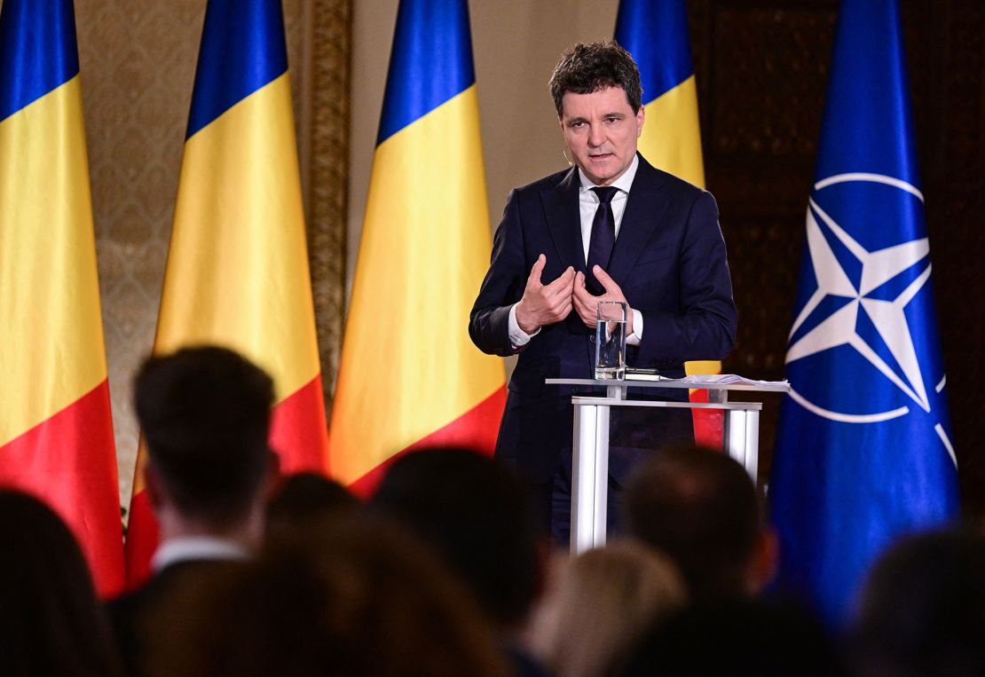 Presidential candidate Nicusor Dan gestures as he speaks during a debate in which his opponent didn't participate, organized by national television TVR in Bucharest, Romania, on May 15, 2025.