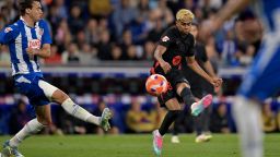 TOPSHOT - Barcelona's Spanish forward #19 Lamine Yamal shoots to score his team's first goal during the Spanish league football match between RCD Espanyol and FC Barcelona at the RCDE Stadium in Cornella de Llobregat, on May 15, 2025. (Photo by MANAURE QUINTERO / AFP) (Photo by MANAURE QUINTERO/AFP via Getty Images)          