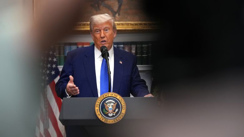 President Donald Trump speaks during a press conference in the Roosevelt Room of the White House.