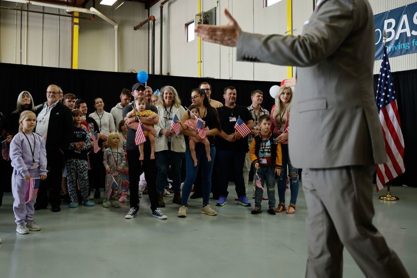 Newly arrived South Africans are welcomed by US Deputy Secretary of State Christopher Landau, at Atlantic Aviation Dulles near Washington Dulles International Airport in Virginia, on May 12, after they accepted an invitation from the Trump administration to come to the United States as refugees.