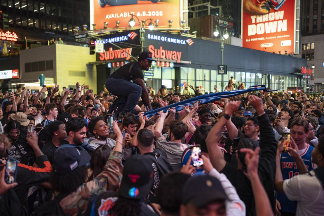 Knicks fans celebrate outside Madison Square Garden after the playoff series win over Boston.