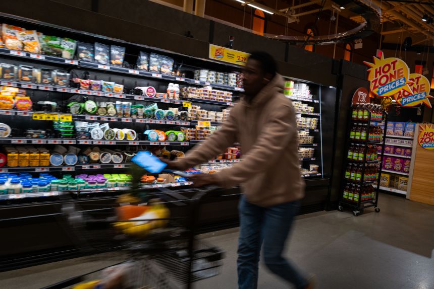 People shop at a grocery store in Brooklyn, New York, on May 13, 2025.