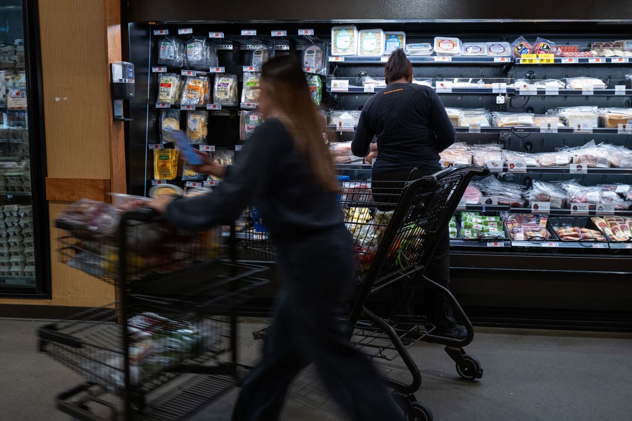 People shop at a grocery store in Brooklyn, New York, on May 13.