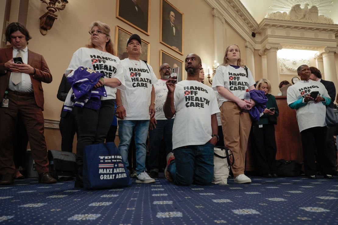 Members of the public where shirts reading 'hands off health care' to show their disapproval of a proposed budget during a markup hearing of the House Ways and Means Committee in the Longworth House Building in Washington, DC, on May 13.