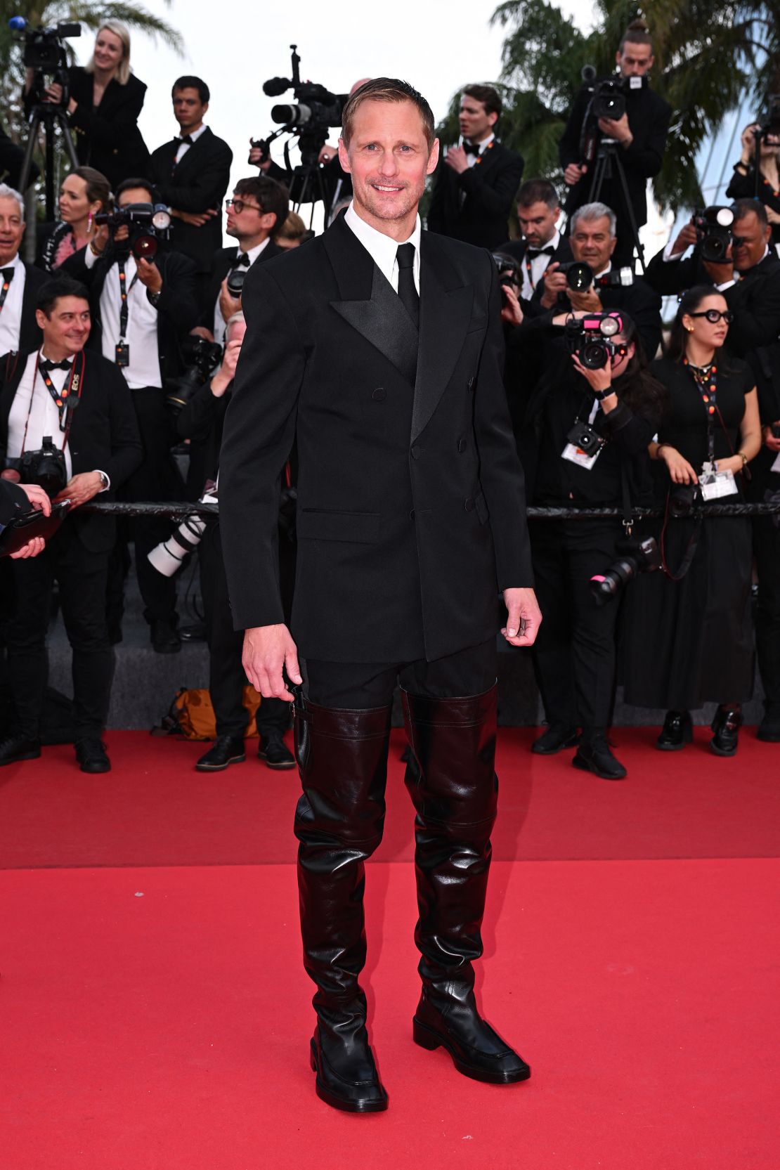 The sky-high leather boots were designed by Saint Laurent.