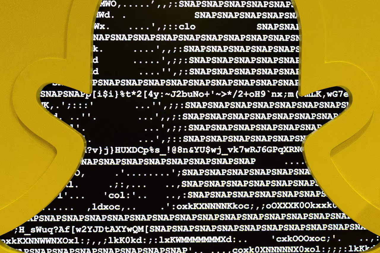 The Snapchat logo against a backdrop of computer code during the inauguration of Snapchat France headquarters in Paris on May 19, 2025.