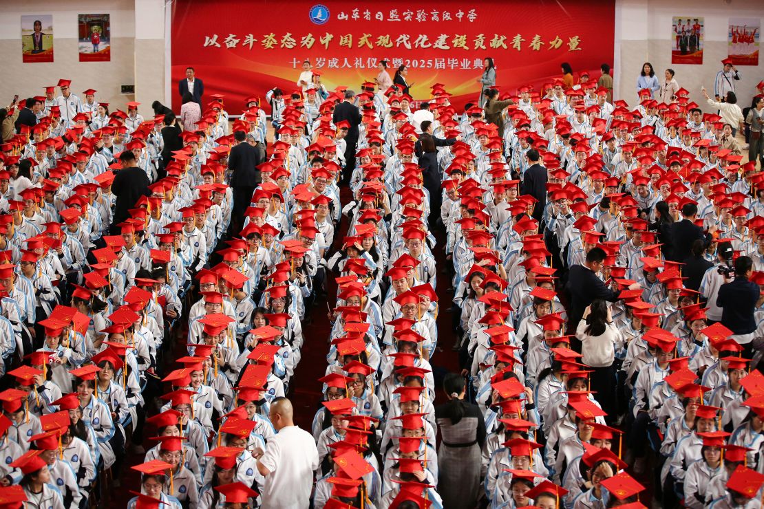 Students in China's Shandong province participate in a graduation ceremony earlier this month. The vast majority of Chinese students who attend university continue their studies in China.