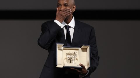 TOPSHOT - US actor Denzel Washington receives the Honorary Palme d'Or ahead of the screening of the film "Highest 2 Lowest" at the 78th edition of the Cannes Film Festival in Cannes, southern , on May 19, 2025. (Photo by Sameer AL-DOUMY / POOL / AFP) (Photo by SAMEER AL-DOUMY/POOL/AFP via Getty Images)          