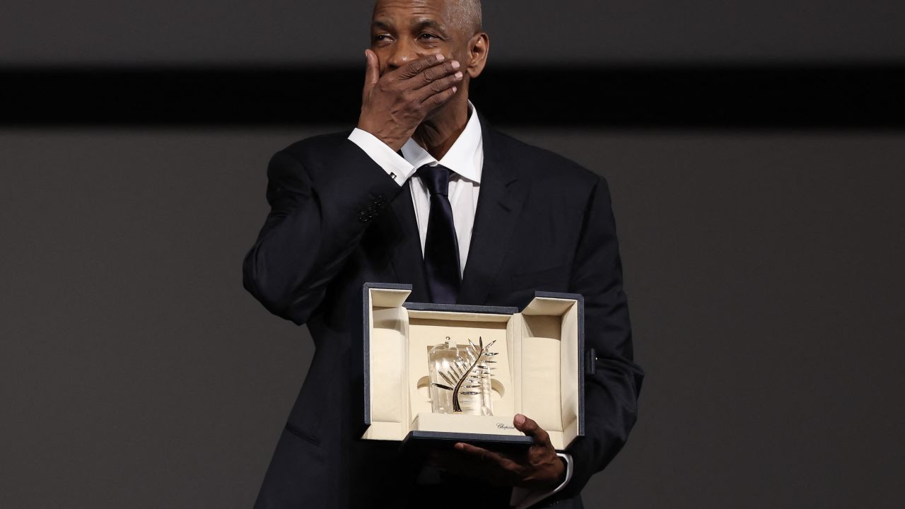 TOPSHOT - US actor Denzel Washington receives the Honorary Palme d'Or ahead of the screening of the film "Highest 2 Lowest" at the 78th edition of the Cannes Film Festival in Cannes, southern , on May 19, 2025. (Photo by Sameer AL-DOUMY / POOL / AFP) (Photo by SAMEER AL-DOUMY/POOL/AFP via Getty Images)          