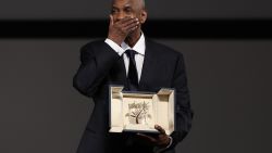 TOPSHOT - US actor Denzel Washington receives the Honorary Palme d'Or ahead of the screening of the film "Highest 2 Lowest" at the 78th edition of the Cannes Film Festival in Cannes, southern , on May 19, 2025. (Photo by Sameer AL-DOUMY / POOL / AFP) (Photo by SAMEER AL-DOUMY/POOL/AFP via Getty Images)          