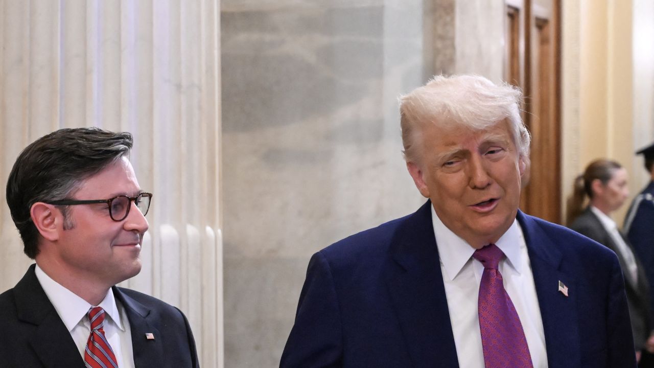 US President Donald Trump and US Speaker of the House Mike Johnson, Republican from Louisiana, speak to the press as he arrives for a House GOP Conference Meeting at the US Capitol in Washington, DC on May 20, 2025. US President Donald Trump rallied Republicans on Capitol Hill Tuesday to back a so-called "big, beautiful bill" that is likely to increase the yawning budget deficit and cut health care for millions of Americans. (Photo by Alex WROBLEWSKI / AFP) (Photo by ALEX WROBLEWSKI/AFP via Getty Images)