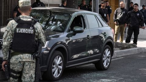 An army soldier stands guard near the crime scene of the killing of Jose Munoz and Ximena Guzman in Mexico city on May 20, 2025. Gunmen on a motorcycle shot dead Munoz and Guzman, an aide to Mexico City Mayor Clara Brugada, at a busy avenue in the capital on May 20, 2025, authorities said. (Photo by Zina DESMAZES / AFP) (Photo by ZINA DESMAZES/AFP via Getty Images)