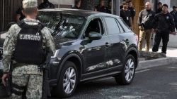An army soldier stands guard near the crime scene of the killing of Jose Munoz and Ximena Guzman in Mexico city on May 20, 2025. Gunmen on a motorcycle shot dead Munoz and Guzman, an aide to Mexico City Mayor Clara Brugada, at a busy avenue in the capital on May 20, 2025, authorities said. (Photo by Zina DESMAZES / AFP) (Photo by ZINA DESMAZES/AFP via Getty Images)          
