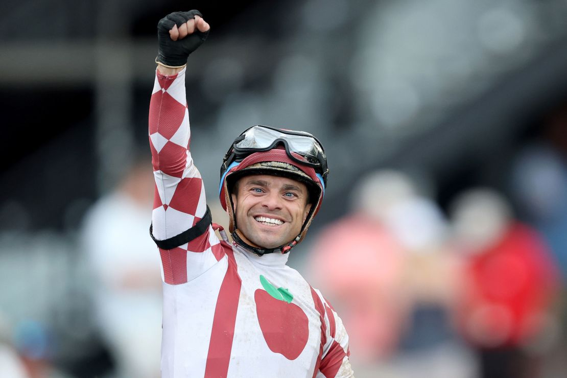 Jockey Umberto Rispoli celebrates aboard Journalism after winning.