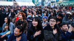 TOPSHOT - People sing during a protest calling for the resignation of Mongolia's Prime Minister Luvsannamsrain Oyun-Erdene over alleged economic mismanagement and corruption involving his family, at Sukhbaatar Square in Ulaanbaatar on May 21, 2025. Hundreds of young Mongolians turned out this week in the country's capital calling for the prime minister's resignation on allegations of corruption, a longstanding source of deep public anger in the landlocked democracy. (Photo by BYAMBASUREN BYAMBA-OCHIR / AFP) (Photo by BYAMBASUREN BYAMBA-OCHIR/AFP via Getty Images)          