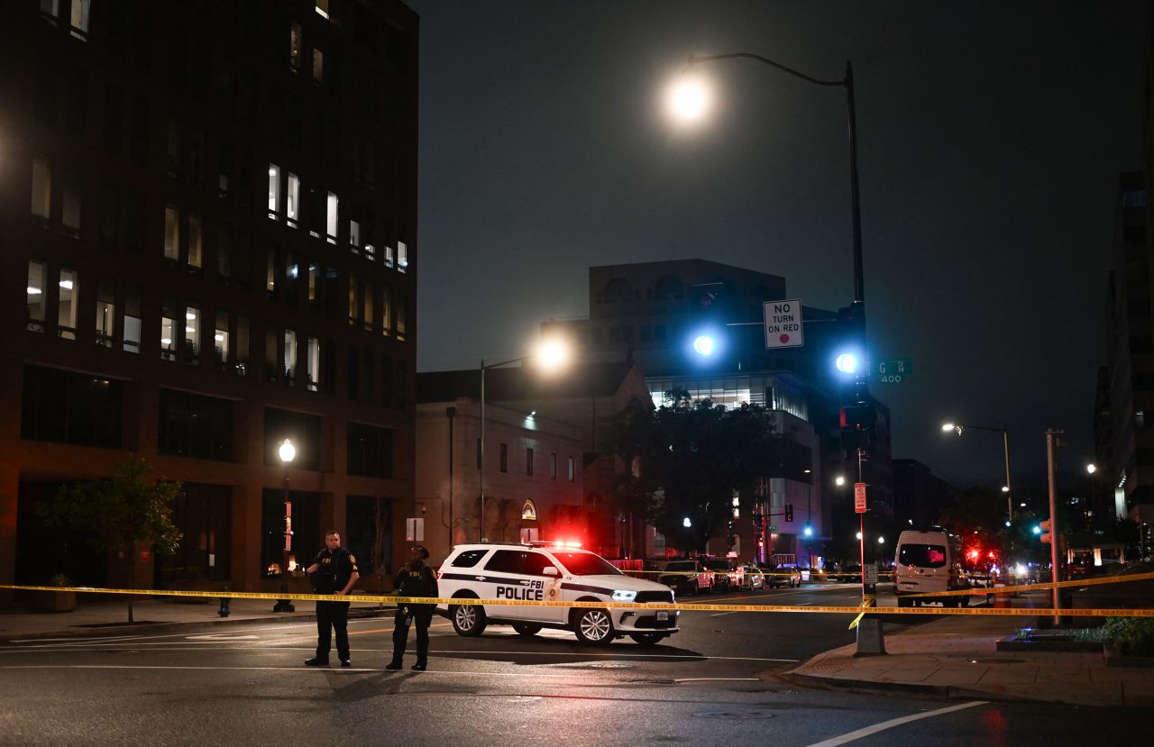 FBI agents cordon off the scene of the shooting outside the Capital Jewish Museum.