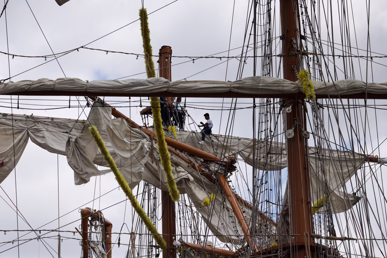 The damaged masts of The Cuauhtémoc are seen as it sits docked at Pier 36 in New York on Sunday.