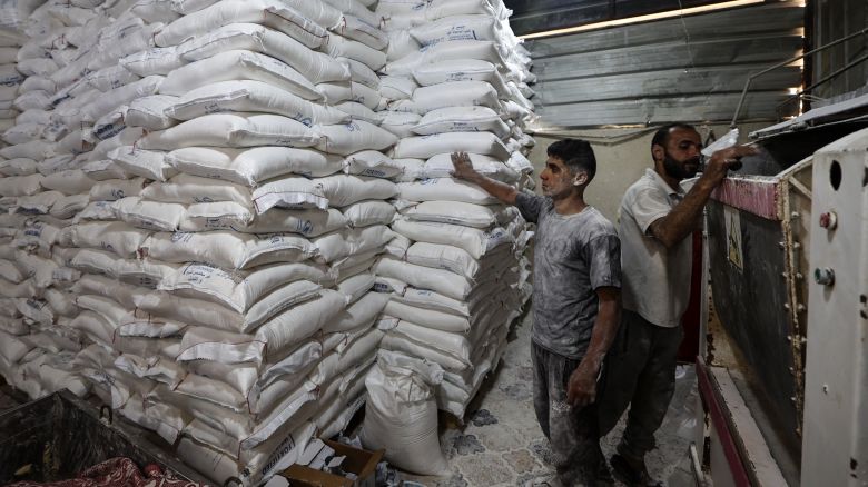 Employees work inside a bakery in Deir el-Balah in the central Gaza Strip, after Israel allowed limited humanitarian aid to enter the Palestinian territory on May 22, 2025. The Hamas government media office reported the arrival of 87 aid trucks, which it said were allocated to international and local organisations to meet "urgent humanitarian needs". (Photo by Eyad BABA / AFP) (Photo by EYAD BABA/AFP via Getty Images)          