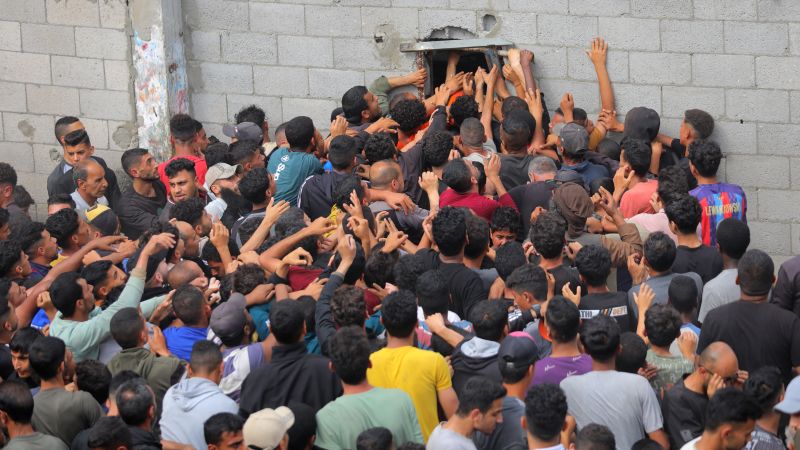 In Gaza, limited food aid meets desperate crowds and looting