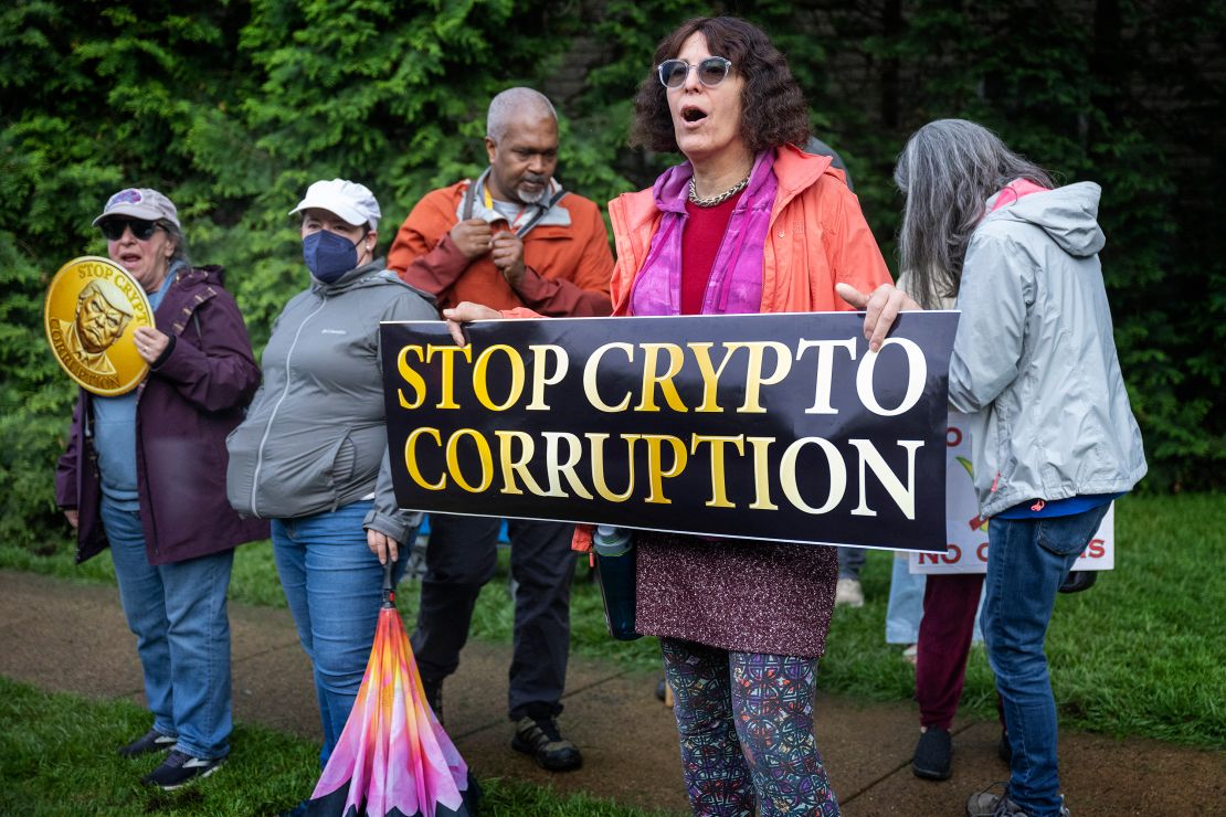 Demonstrators shout outside Trump National Golf Course in Sterling, Virginia, on May 22, 2025.