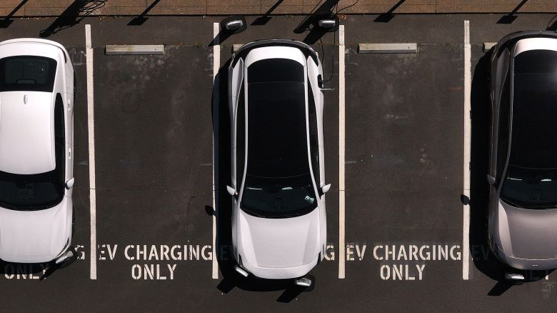 In an aerial view, electric cars sit parked at a charging station on May 19, 2025 in Corte Madera, California. Republican lawmakers in Washington DC are poised to vote on waivers that allow California to set its own emission standards.