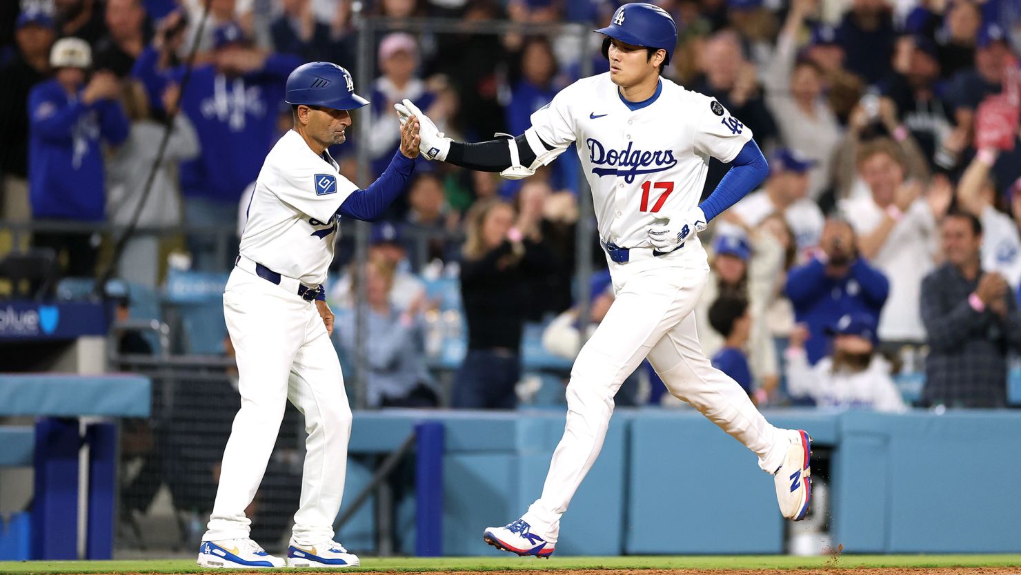 Shohei Ohtani of the Los Angeles Dodgers reacts after hitting a solo home run against the Arizona Diamondbacks during the sixth inning at Dodger Stadium on May 19.