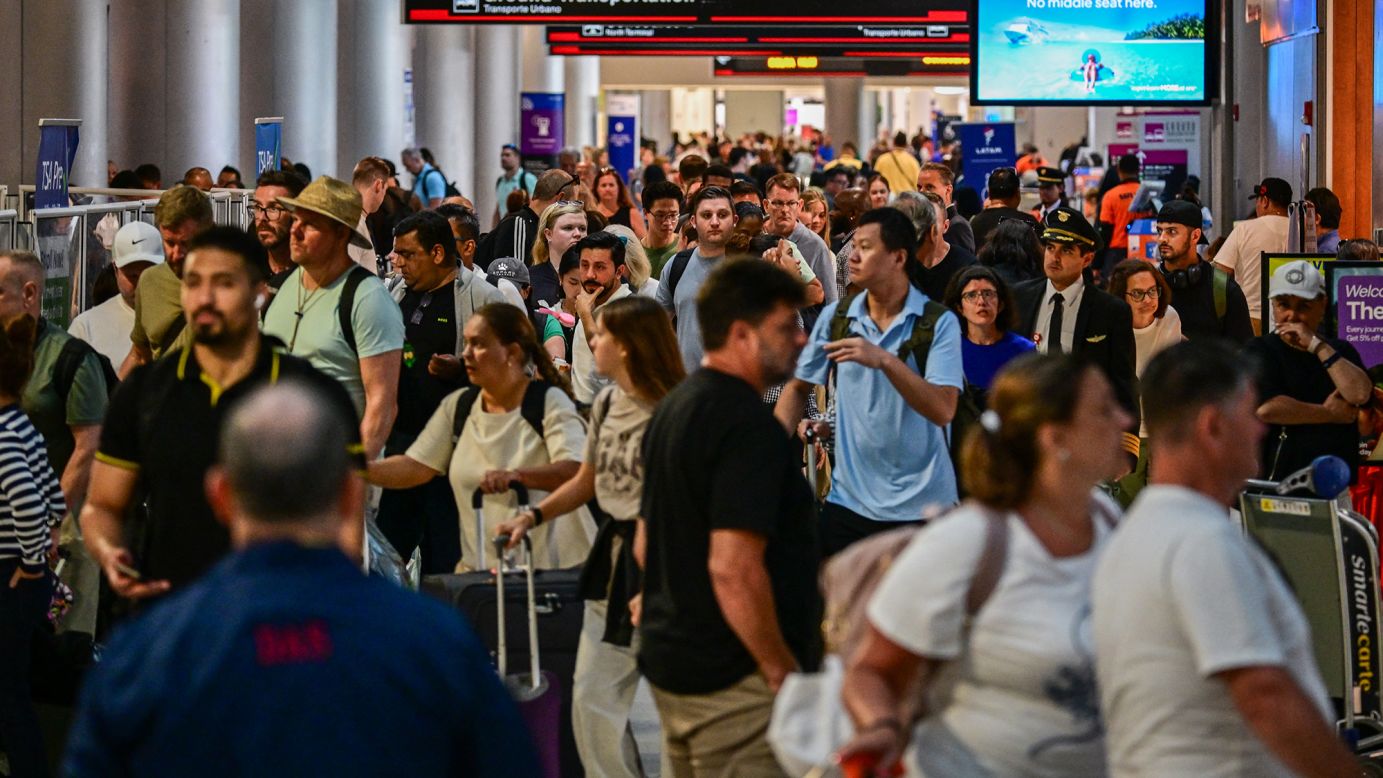 Travelers pass through Miami International Airport during 2025's busy Memorial Day weekend.