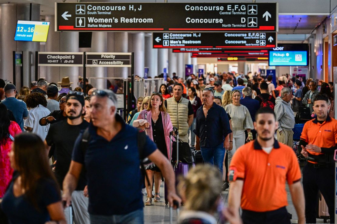 Crowds of travelers make their way through Miami International Airport during 2025's Memorial Day weekend.