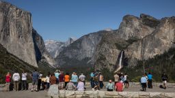 Visitors take in the scenery from Tunnel View in Yosemite National Park, Calif., on Tuesday, May 20, 2025.  On Memorial Day Weekend, visitors will be required to make reservations. (Photo by Carlos Avila Gonzalez/San Francisco Chronicle via Getty Images)