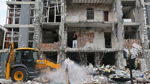A local resident stands in a damaged flat of a multistory residential building following a drone strike in Kyiv on May 25, 2025, amid Russian invasion in Ukraine. Russia launched a record number of drones against Ukraine and killed 12 people across the country, officials said on May 25, even as Kyiv and Moscow completed their biggest prisoner exchange since the start of the war. (Photo by Sergei SUPINSKY / AFP) (Photo by SERGEI SUPINSKY/AFP via Getty Images)          