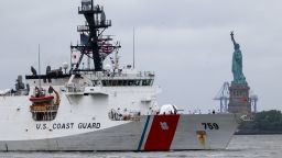 A Coast Guard ship sails past the Statue of Liberty on May 21 in New York City.