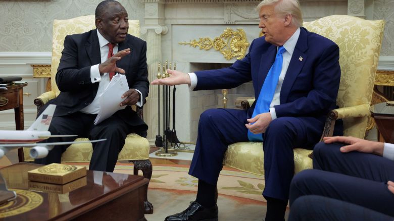 WASHINGTON, DC - MAY 21: U.S. President Donald Trump and South Africa President Cyril Ramaphosa talk to each other during a press availability in the Oval Office at the White House on May 21, 2025 in Washington, DC. Relations between the two countries have been strained since Trump signed an executive order in February that claimed white South Africans are the victims of government land confiscation and race-based “genocide,” while itting some of those Afrikaners as refugees to the United States. Trump also halted all foreign aid to South Africa and expelled the country’s Ambassador to the U.S., Ebrahim Rasool. (Photo by Chip Somodevilla/Getty Images)