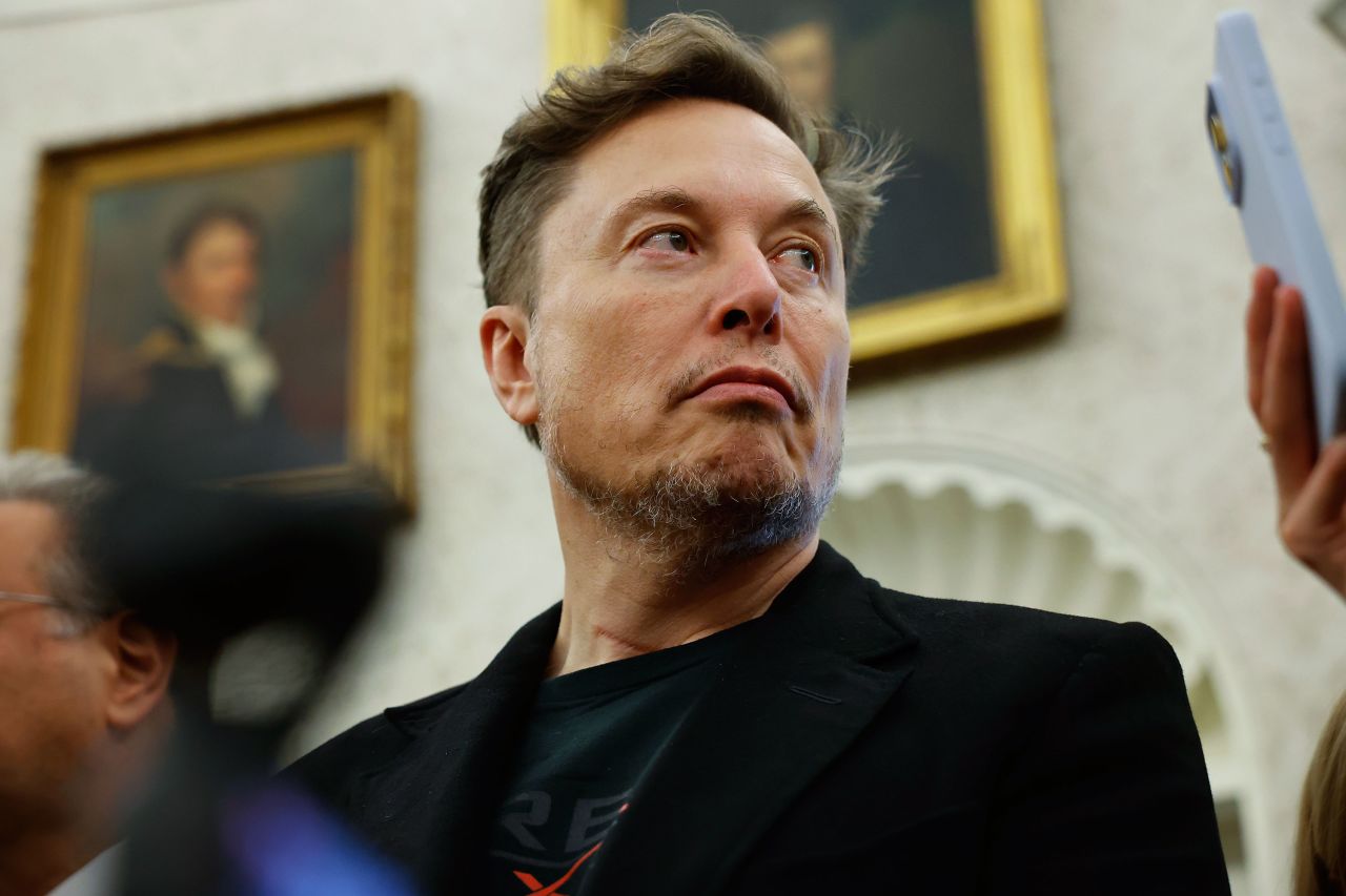 Elon Musk listens as reporters ask US President Donald Trump and South African President Cyril Ramaphosa questions during a press availability in the Oval Office of the White House in Washington, DC, on May 21.