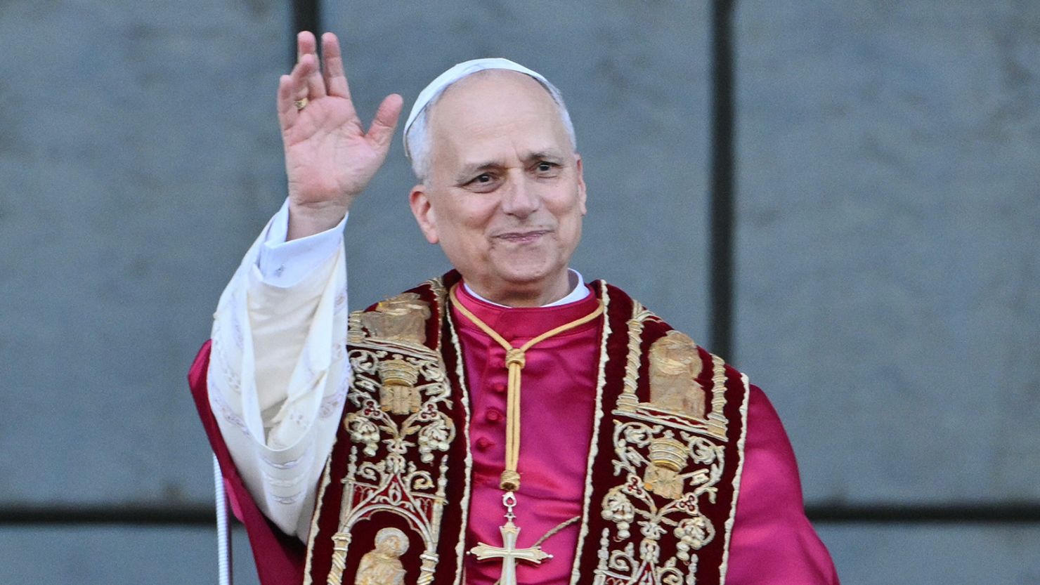 Pope Leo XIV waves to the crowd from the main central balcony of Saint John Lateran archbasilica after a holy mass in Rome, on May 25, 2025.