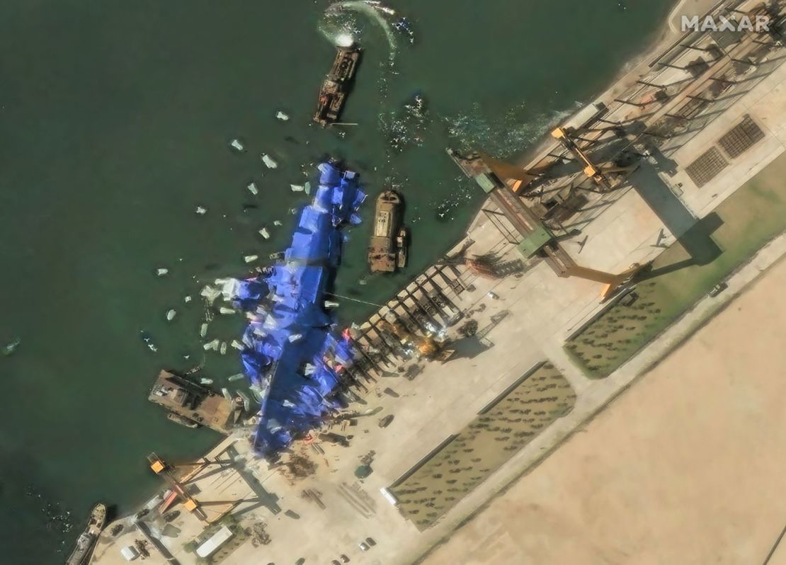 Maxar imagery shows continued efforts to conceal the damaged destroyer at Hambuk Shipyard one day after the failed launch.