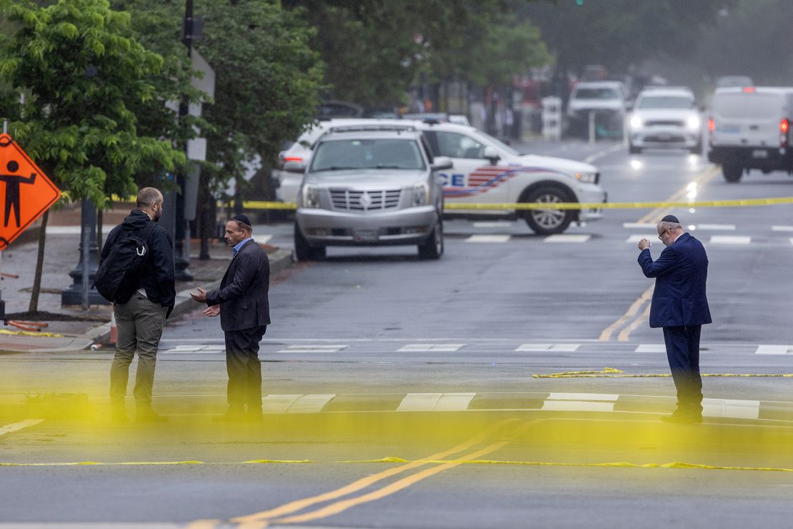 Police and Investigators work at the crime scene on Thursday.