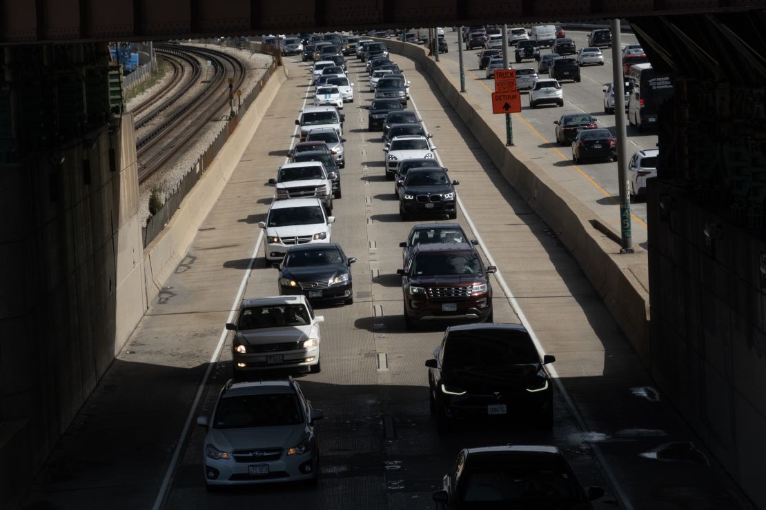 Traffic jams the highway as the exodus of holiday travelers begins for Memorial Day weekend in Chicago. People may opt for less expensive vacations and road trips with this summer's uncertainties.